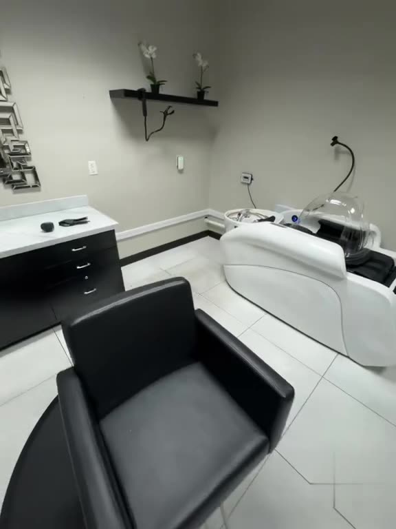 Finished salon room with shampoo units plumbed and fixtures set